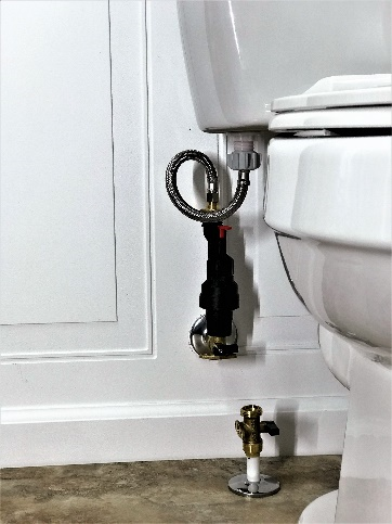 Water Block and Reset Device installed on a home toilet. Protects toilet from running water leaks and saves water plus money.