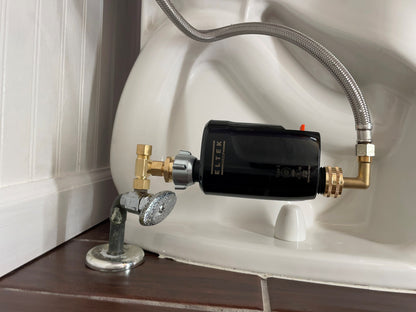 Electronic WaterBlock point-of-use smart water monitor installed on a toilet. Tracks water flow and consumption volume while detecting and shutting off micro to macro leaks.