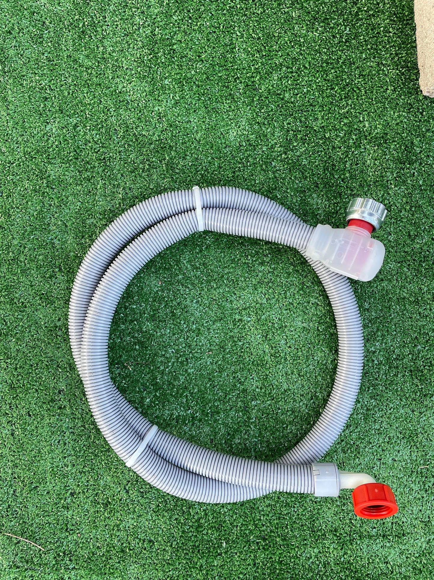 Hot water dishwasher supply hose with automatic shutoff valve to prevent leaks and floods. This durable hose features a braided inner supply hose shielded in a corrugated outer plastic casing for extra protection. The automatic shutoff valve quickly cuts off the water source if a leak is detected, helping to prevent costly water damage.