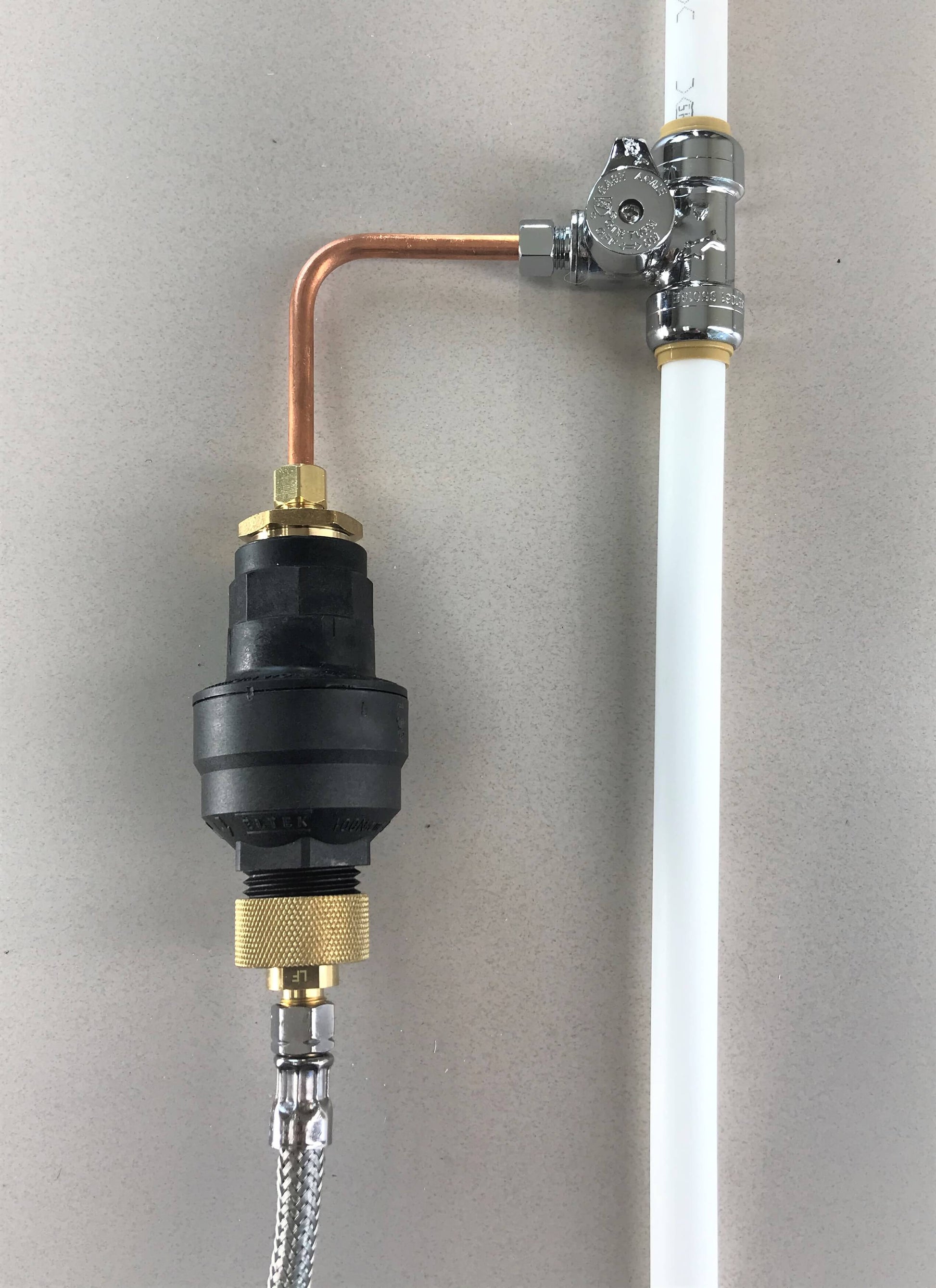 Water Block 3/8" shutoff kit configuration connected to a 3/8" stainless steel hose and a 3/8" copper supply line. This is good for a refrigerator, beverage machine, or water fountain application.