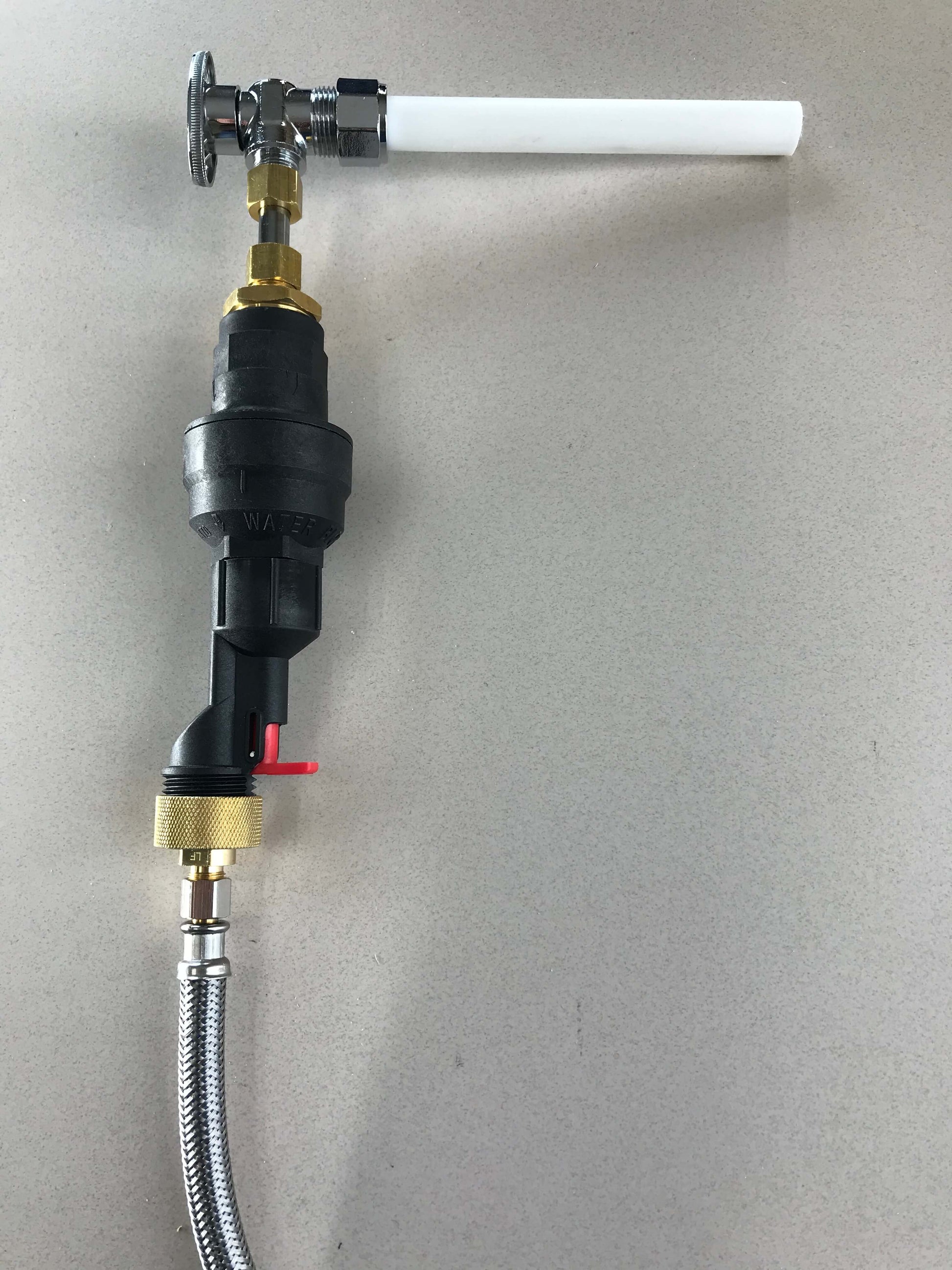 Water Block, Water Block Reset Device, 1/4" John Guest Quick Connect, and 1/4" water supply line fitting connected to a copper supply line and a supply hose, protecting a home from water damage caused by leaks and floods.