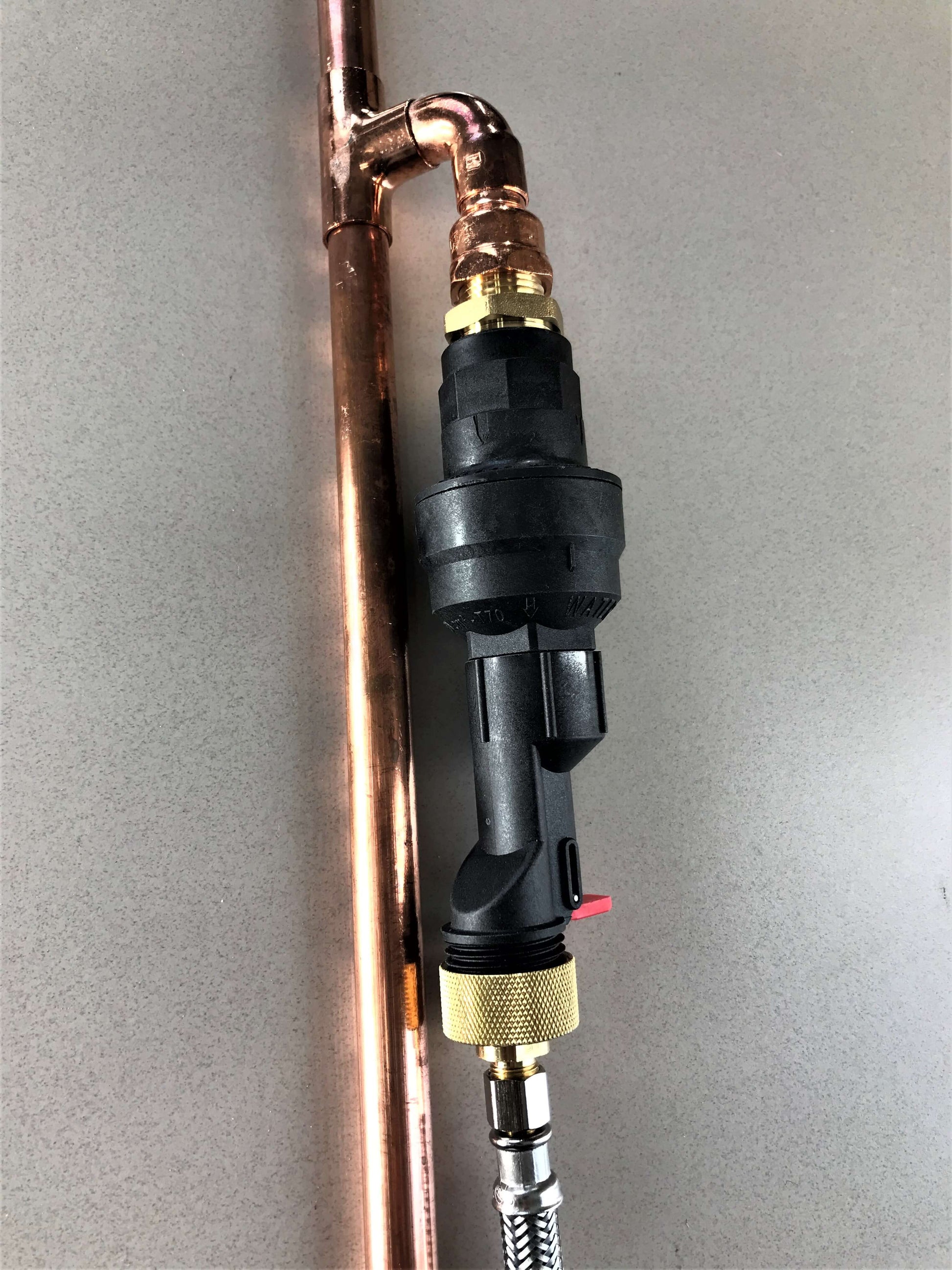 Water Block connected to a copper pipe and 3/8" stainless steel braided water hose.